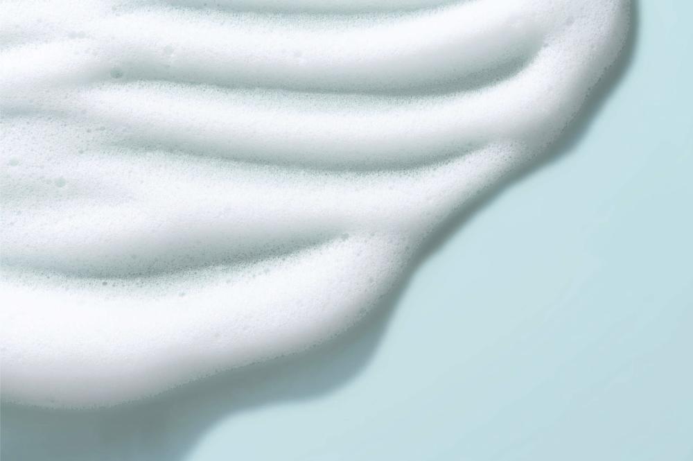 Textura espuma de los limpiadores de Etat Pur representando un limpiador sin activos puros.